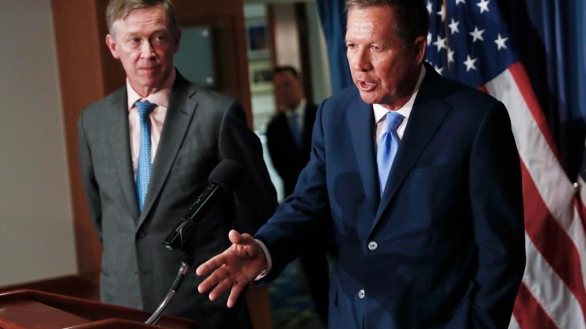 Republican Ohio Gov. John Kasich, right, and Democratic Colorado Gov. John Hickenlooper, shown here in June at a Washington news conference, are among those calling for bipartisan health insurance reform.