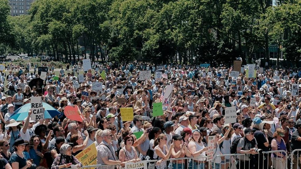 Demonstrators watch and listen to speakers at a protest rally in Cadman Plaza in New York, June 30, 2018. Demonstrators and activists gathered en masse at Foley Square to protest the Trump administrations zero tolerance immigration policy. (Christopher Lee/The New York Times)