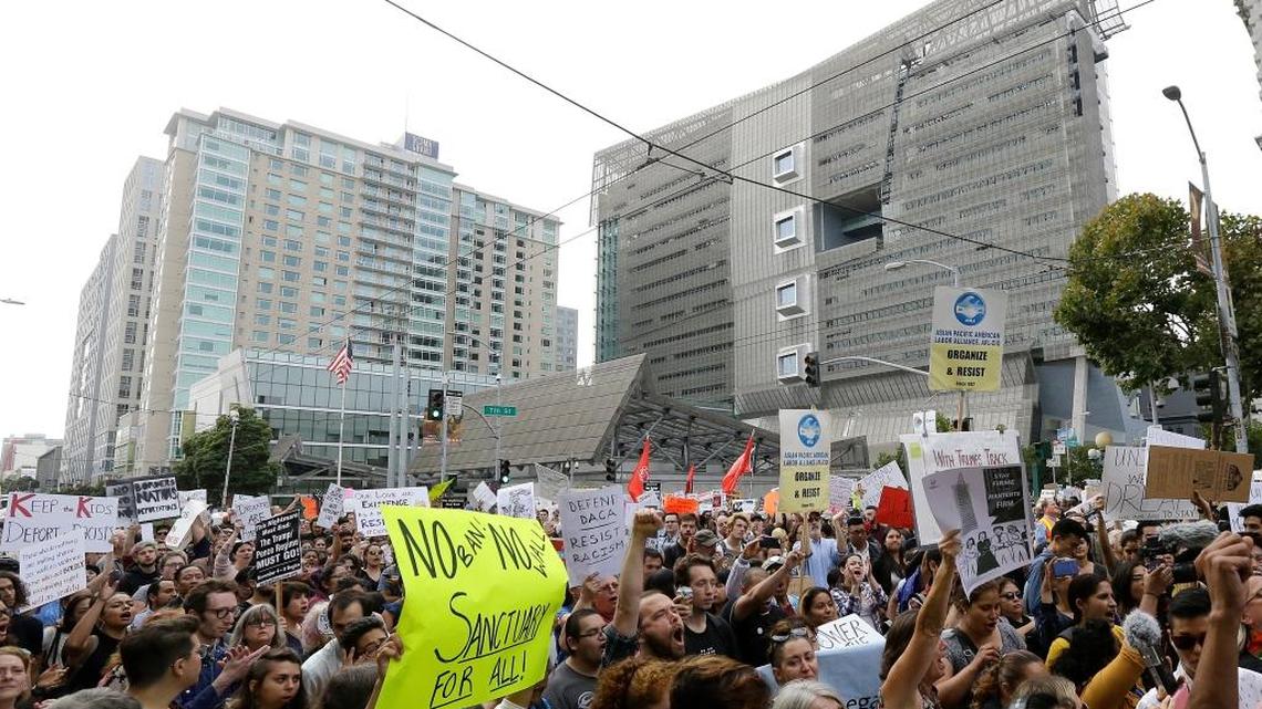 Supporters of Deferred Action for Childhood Arrivals (DACA) yell during a protest outside of the Federal Building in San Francisco, Tuesday, Sept. 5, 2017. President Donald Trump on Tuesday began dismantling DACA, the government program protecting hundreds of thousands of young immigrants who were brought into the country illegally as children. (AP Photo/Jeff Chiu)