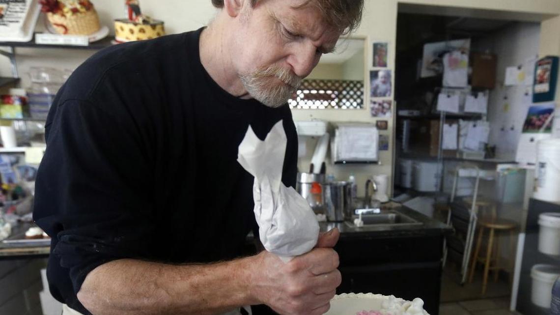 In this March 10, 2014 photo, Masterpiece Cakeshop owner Jack Phillips, who refused to bake a wedding cake for a gay couple, citing his religion, decorates a cake inside his store in Lakewood, Colo. The U.S. Supreme Court on Dec. 5 will hear oral arguments on whether Colorado’s public accommodations law violated the First Amendment by not permitting him to discriminate. (AP Photo/Brennan Linsley)