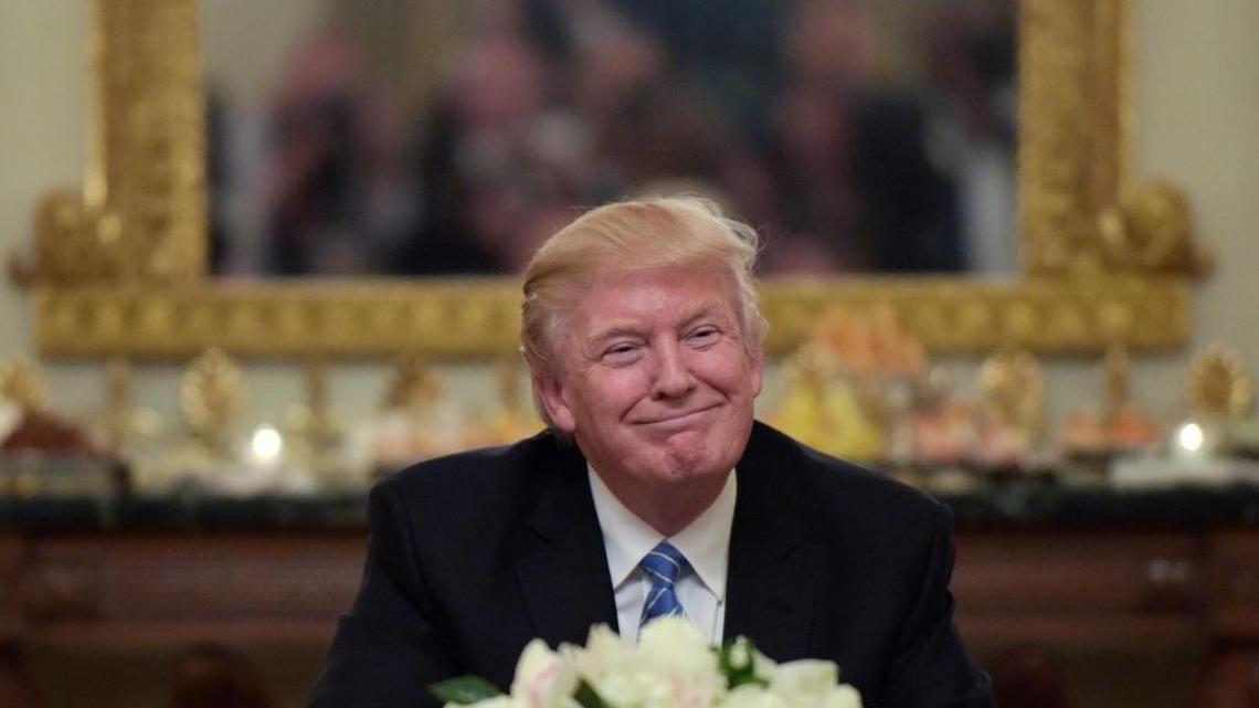 President Donald Trump hosts a reception for House and Senate leaders in the State Dining Room of the White House on Monday.