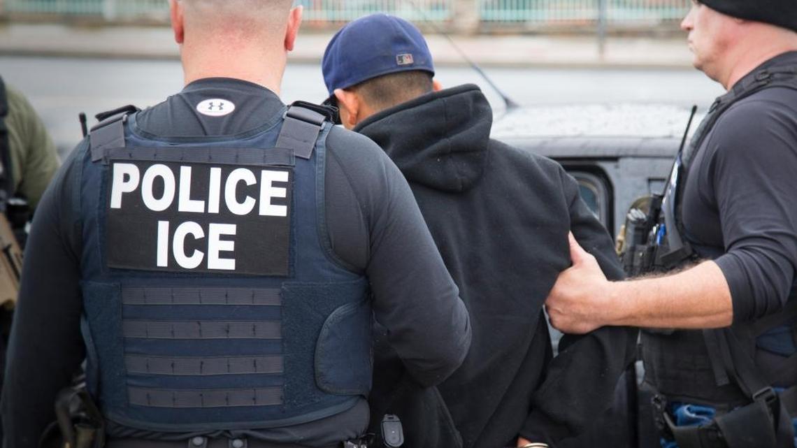Foreign nationals are arrested in Los Angeles in February in a targeted operation by U.S. Immigration and Customs Enforcement (ICE). California’s “sanctuary state” bill, SB 54, would limit the involvement of local police and sheriffs in federal immigration enforcement.