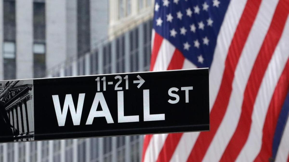 A Wall Street sign near the New York Stock Exchange. The economist Thomas Piketty warned that policies like those in Trump’s tax plan supercharge inequality and favor oligarchs over democracies. (AP Photo/Mark Lennihan)