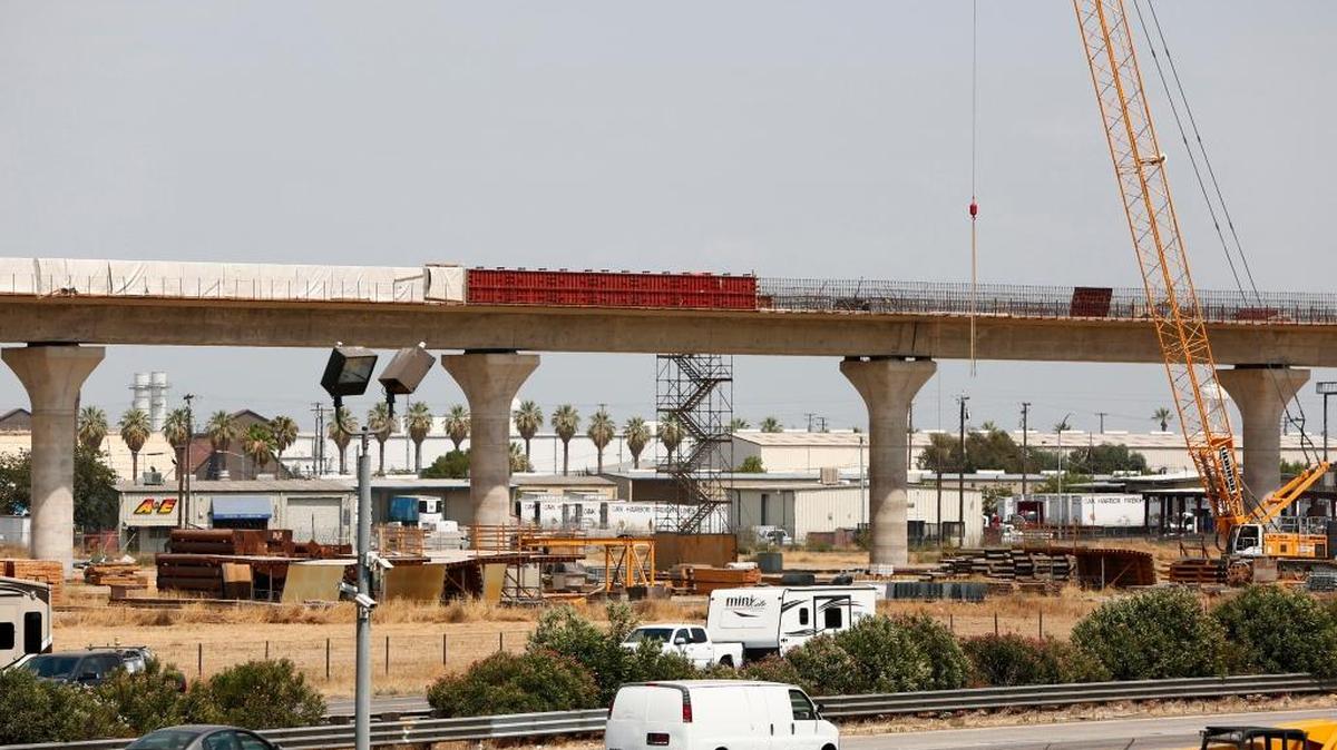 The Cedar Viaduct of California’s high-speed rail project with Highway 99 in the foreground, under construction in Fresno in 2017. A $20 billion segment between Fresno and San Jose is scheduled to open by 2025. (Gary Reyes/Bay Area News Group/TNS)