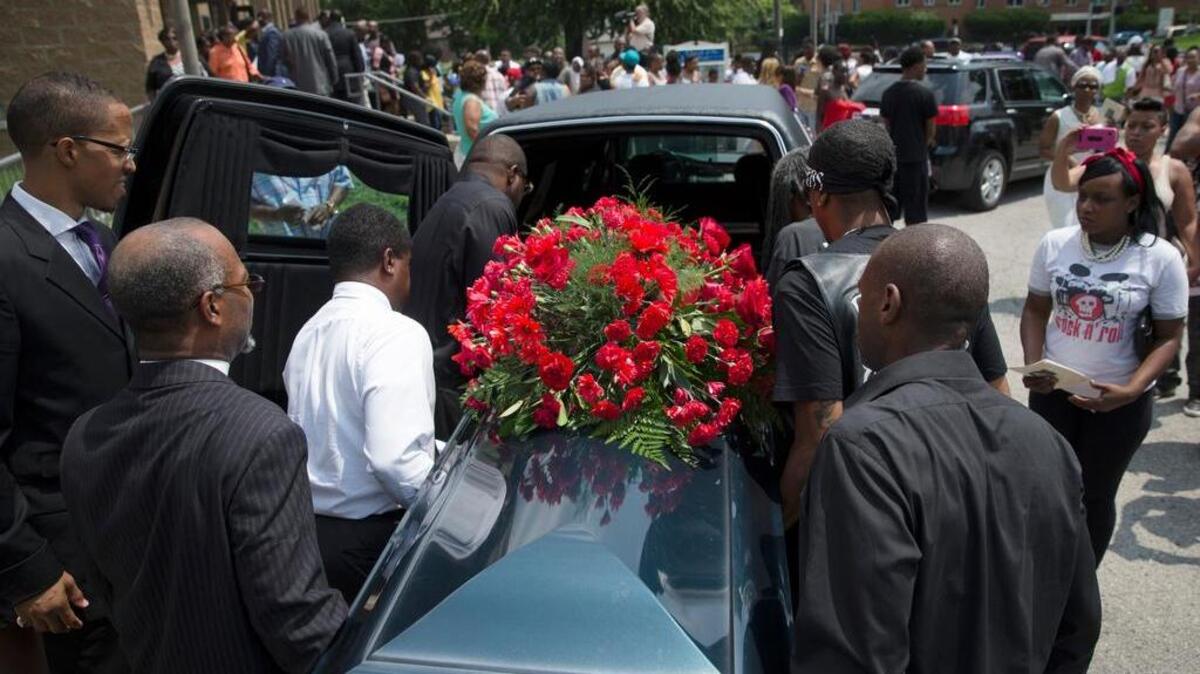 
The casket of Samuel Dubose is taken to a hearse during his funeral at the Church of the Living God in Cincinnati on July 28.
