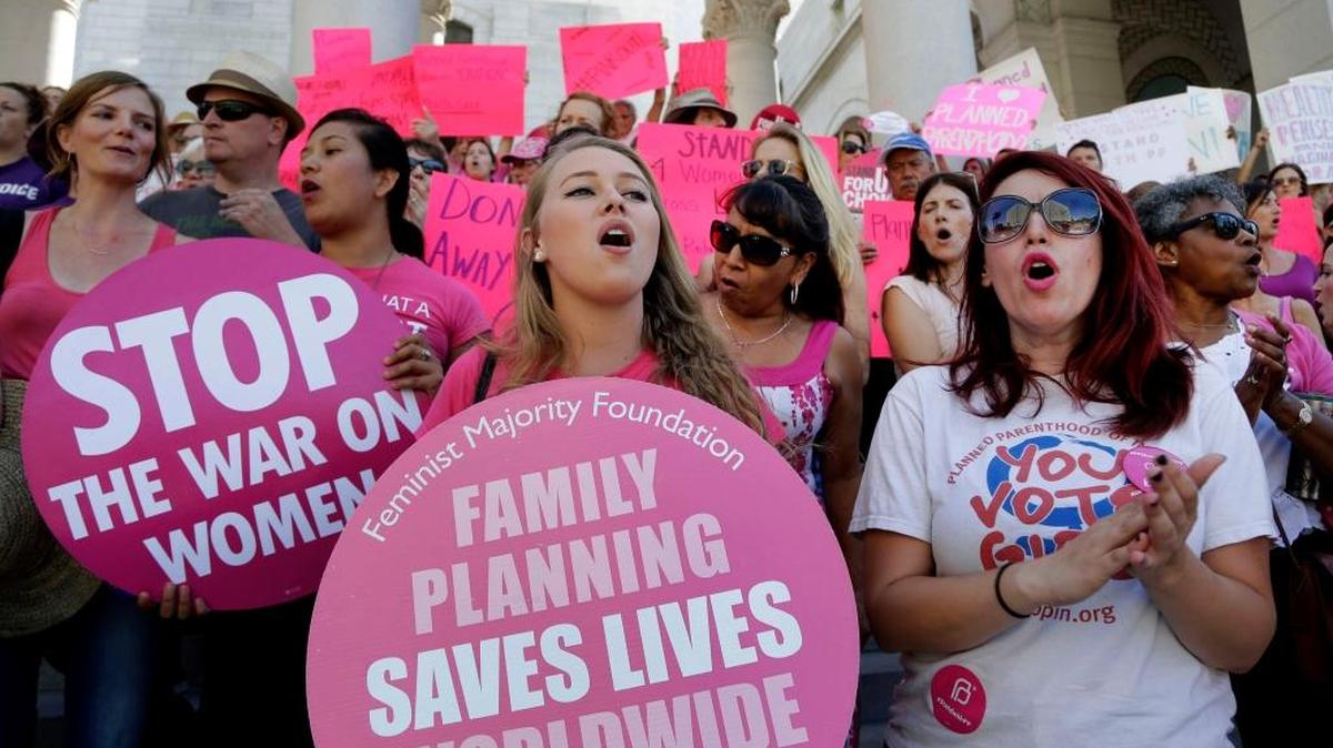 Women in Los Angeles rally for access to contraception in 2015. California is suing to halt a rollback by President Donald Trump of Affordable Care Act provisions mandating that employer health insurance programs include birth control benefits.