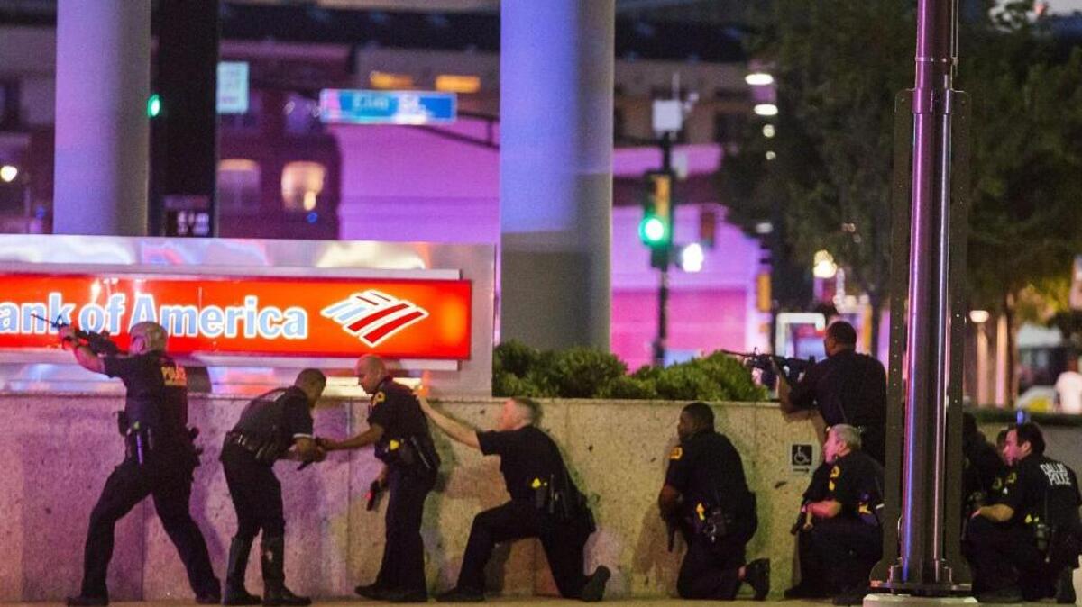 Dallas police respond after shots are fired at a Black Lives Matter rally in downtown Dallas on Thursday. Five police officers were killed and seven others wounded in Dallas during a protest over recent police shootings in Minnesota and Louisiana.