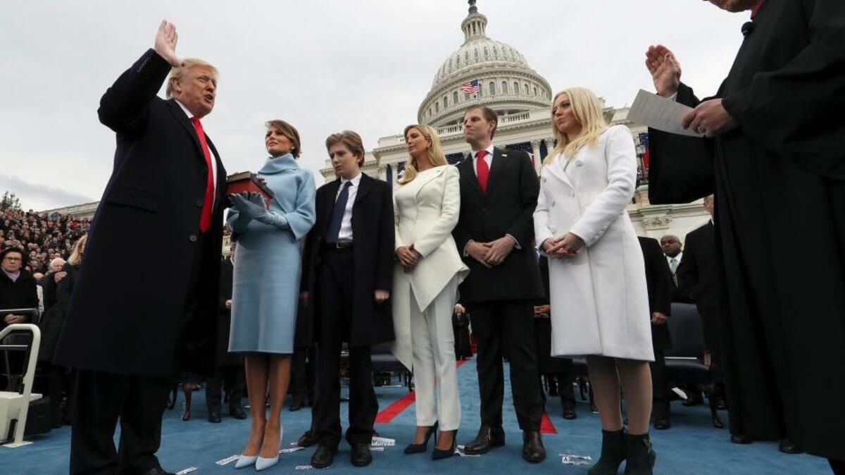 President Donald Trump takes the oath of office from Chief Justice John Roberts, as his wife Melania holds the Bible, and with his children Barron, Ivanka, Eric and Tiffany, Friday, Jan. 27, 2017 on Capitol Hill in Washington. (Jim Bourg/Pool Photo via AP)