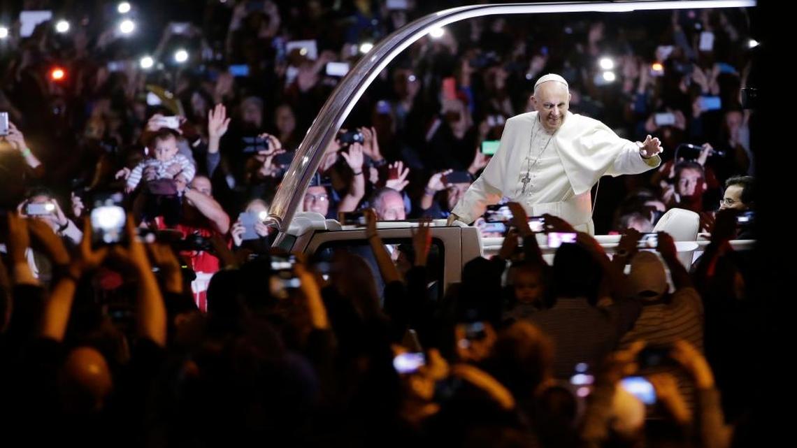 
Pope Francis waves to the crowd during a parade in Philadelphia last month. The pontiff attended a music-and-prayer festival there Saturday night to close out the World Meeting of Families, a Vatican-sponsored conference of more than 18,000 people from around the world. 
