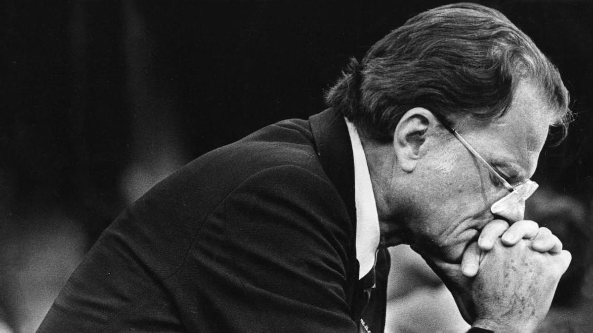 Rev. Billy Graham prays during a service memorial in Baltimore on June 10, 1981.
