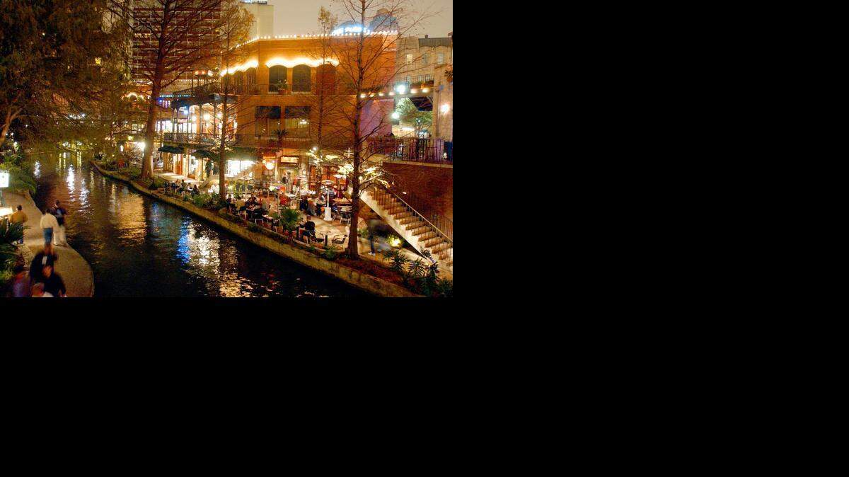 
Restaurant customers enjoy dinner at the water’s edge along the manmade River Walk in San Antonio, Texas. Planners envision a similar river walk attraction in downtown Sacramento as part of the railyard development project.


