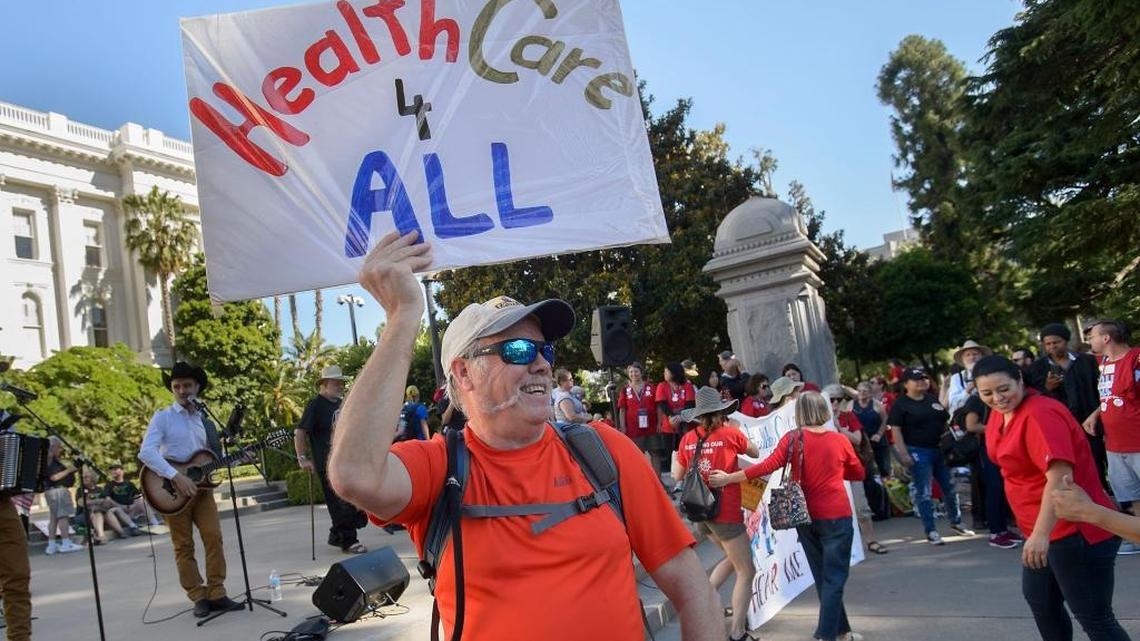 A supporter of Senate Bill 562 demonstrates on the west steps of the state Capitol. SB 562 would create a universal single-payer health care system in California, but at an estimated cost of up to $400 billion.