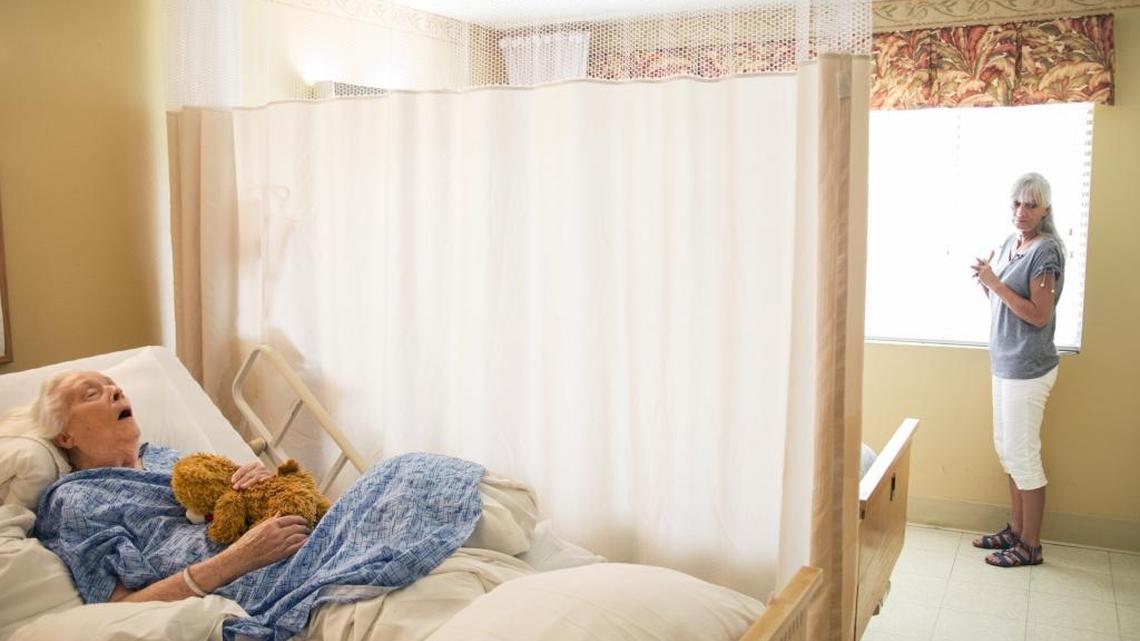 Laurel Cline, Aug. 3, 2017, during a visit to her mother Lenora, who has Alzheimer’s disease, in a nursing home in Whittier. Cline says her mother, during stays at three different nursing homes in recent years, was sometimes left neglected for hours at a time in her wheelchair after being given antipsychotics. (Ed Kashi/Human Rights Watch via AP)