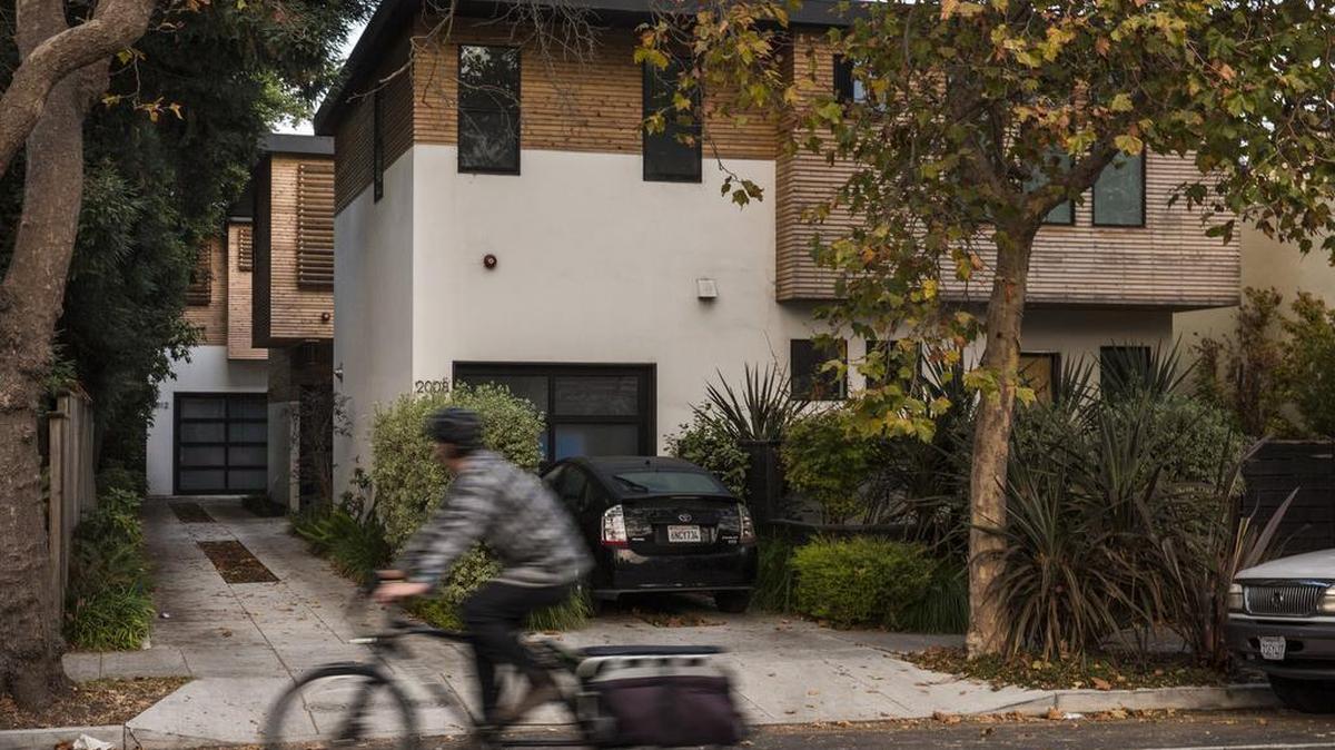 Three homes sit on a single plot of land in Berkeley as California cities struggle to keep up with housing demand.