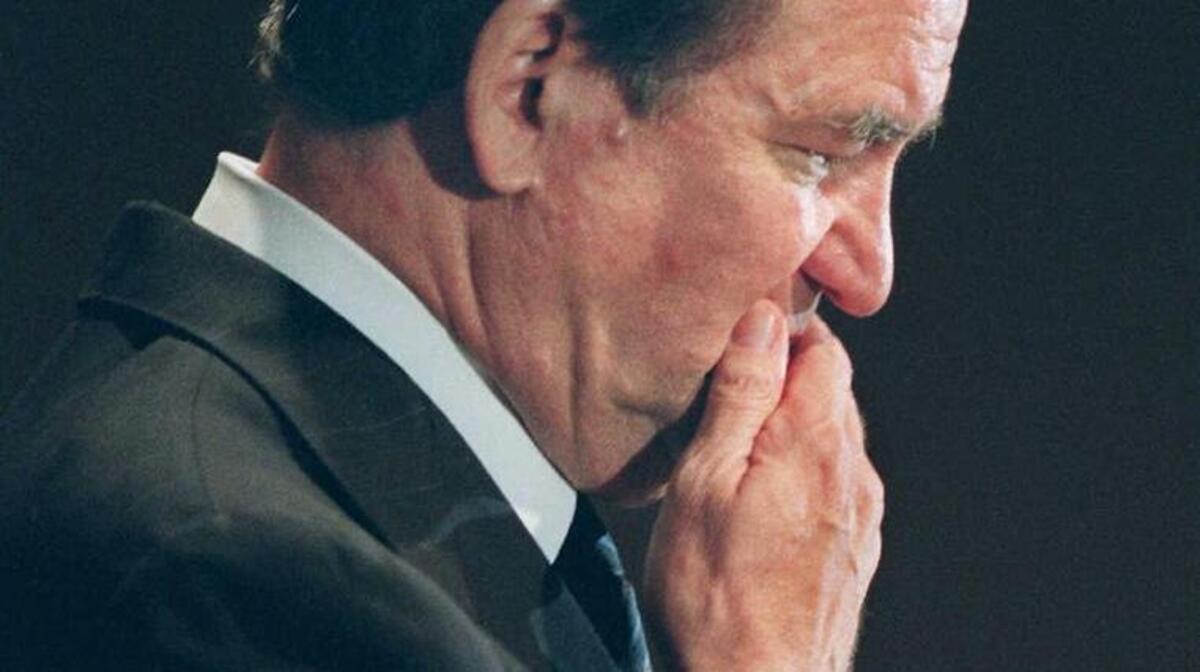 
Patrick Buchanan, then a Republican presidential hopeful, ponders a reporter’s questions during a news conference in Washington in July 1996.
