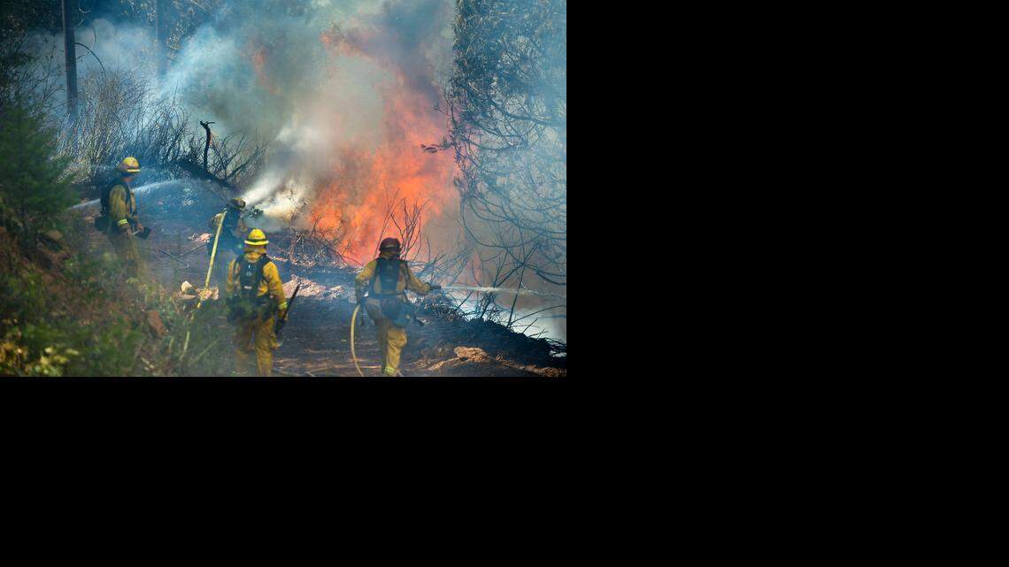 
Cal Fire strike crews battle the King fire in El Dorado County near Fresh Pond in September.
