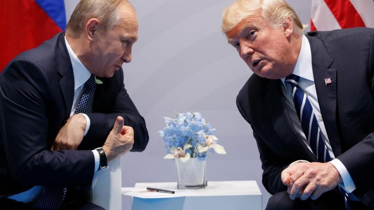 President Donald Trump, right, meets with Russian President Vladimir Putin in 2017 at the G-20 Summit in Hamburg, Germany. Despite increasingly urgent concerns about ongoing Russian meddling in U.S. elections, Trump’s reprisals against the Kremlin have been minimal. (AP Photo/Evan Vucci)