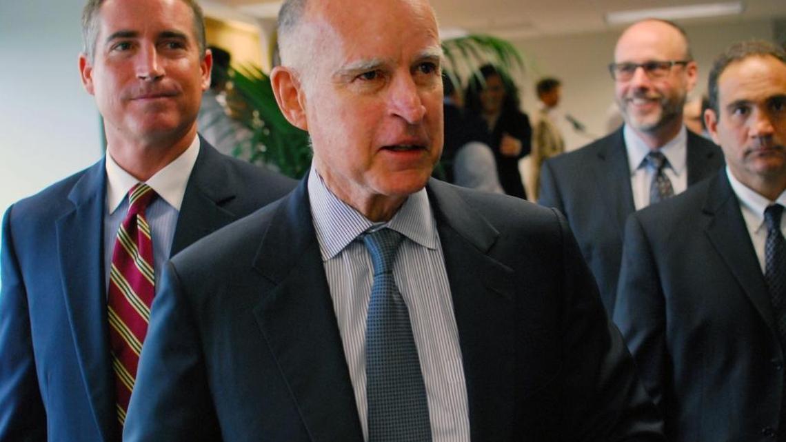 Gov. Jerry Brown visits Takeda, a biotech firm, in 2013 in San Diego, where he signed legislation overhauling economic development programs such as enterprise zones. (AP Photo/ U-T San Diego, Carolyne Corelis)