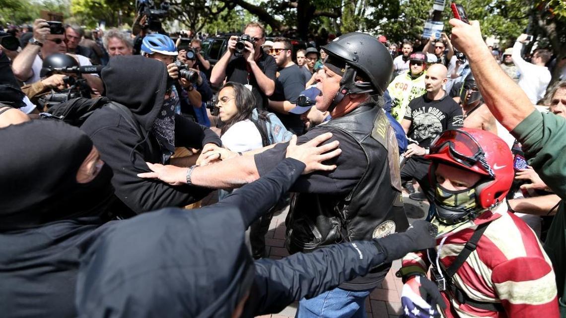Anti- and pro-Trump supporters clash in 2017 during competing demonstrations at Martin Luther King Jr. Civic Center Park in Berkeley. (Anda Chu/Bay Area News Group/TNS)