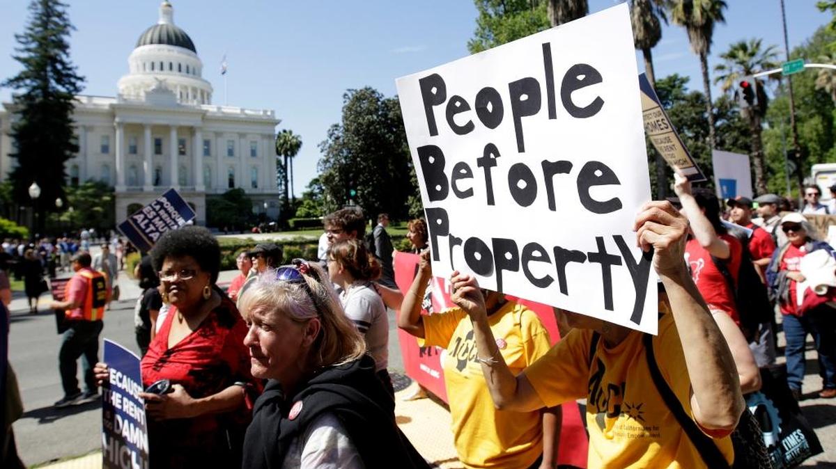 Supporters of a rent control initiative march to the Capitol on Monday, April 23, 2018, in Sacramento, Calif. California’s housing crisis has placed land use on the front burner throughout the state. (AP Photo/Rich Pedroncelli)
