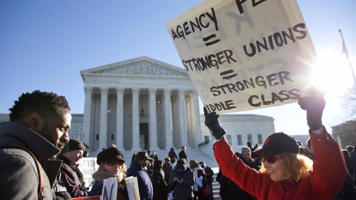 Public employee unions rally outside of the Supreme Court in Washington, Monday, Jan. 11, 2016, to preserve the collection of “fair share” dues from non-members who benefit from collective bargaining. Court conservatives view the practice, which supports organized teachers, firefighters and other public sector employees, as a violation of non-members’ free speech. (AP Photo/Jacquelyn Martin)