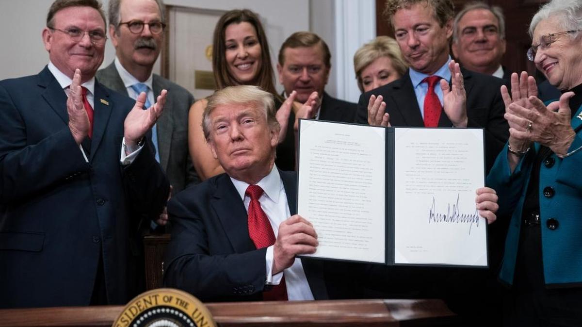 President Donald Trump signs an executive order on health care the White House last week ending subsidies that help cover copayments for the poor.