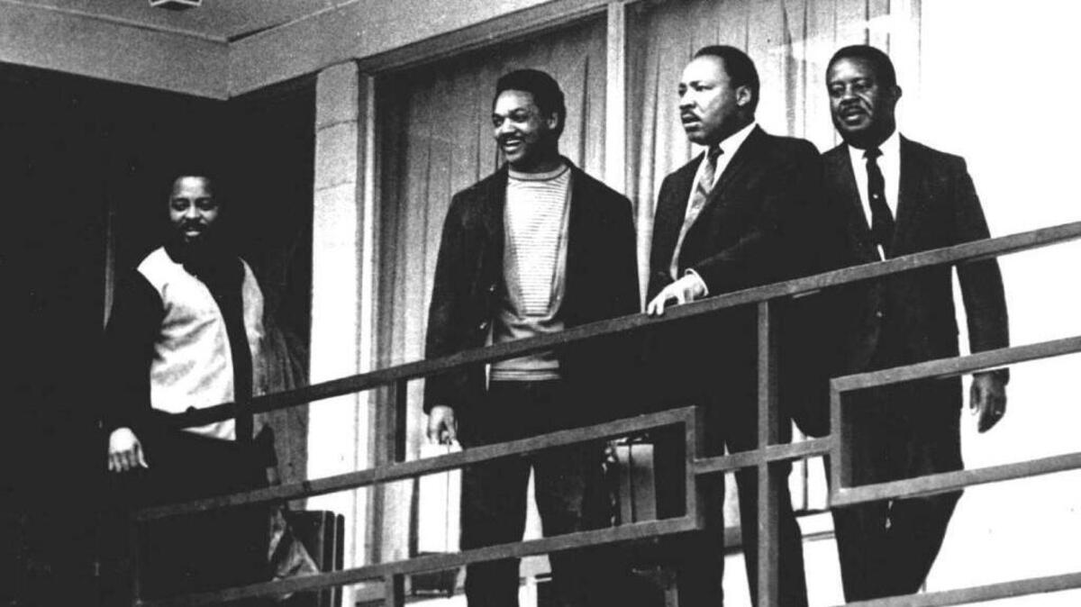 The Rev. Martin Luther King Jr., second from right, stands on the balcony of the Lorraine Motel in Memphis, Tenn., on April 3, 1968. He was killed at that motel the following day.