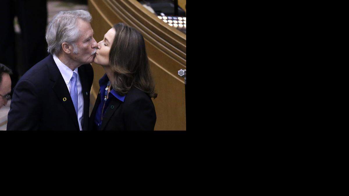 
Oregon Gov. John Kitzhaber kisses his girlfriend, Cylvia Hayes, after being sworn in for an unprecedented fourth term last month. Kitzhaber is facing increasing calls for him to resign after revelations that he helped Hayes secure state contracts.
