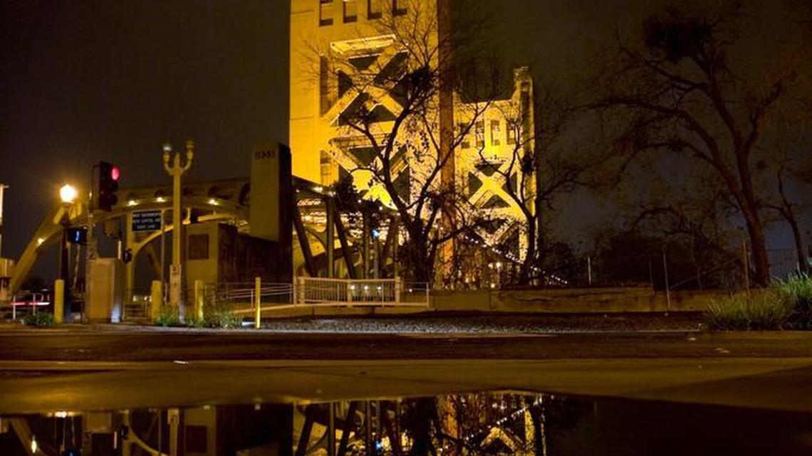 The Tower Bridge and its reflection after a rainstorm in Sacramento. A private group hopes to illuminate it with colorful LED lights.