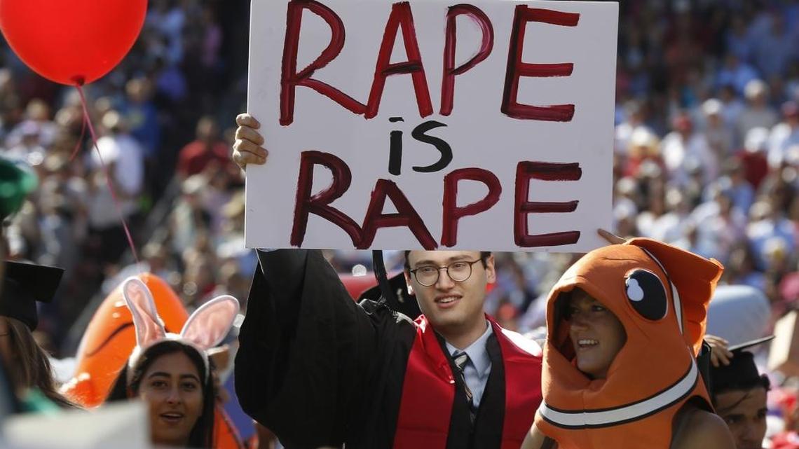 Paul Harrison carries a sign of protest during Stanford University’s graduation ceremony earlier this month. Former Stanford University swimmer Brock Turner was sentenced to six months in jail for sexually assaulting an unconscious woman outside of a fraternity party.