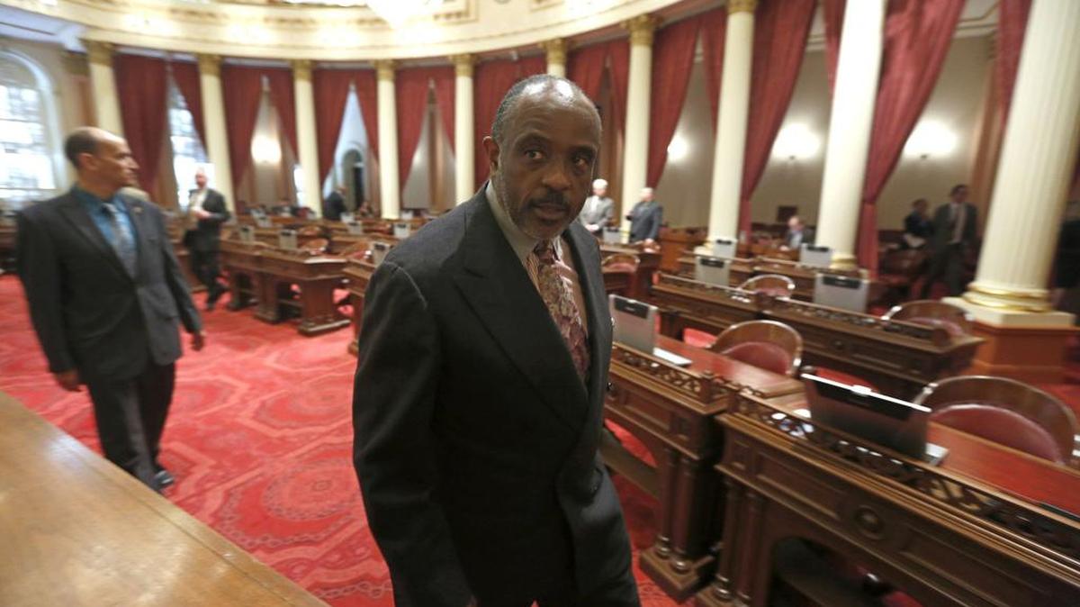 State Sen. Rod Wright, D-Inglewood, leaves the Senate Chambers after being convicted in 2014 on felony charges stemming from living outside his Gardena district.