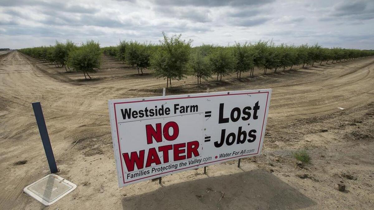 Signs like this one dotted the landscape around farms in Fresno County in 2015, when the Westlands Water District did not receive any surface water during the drought.