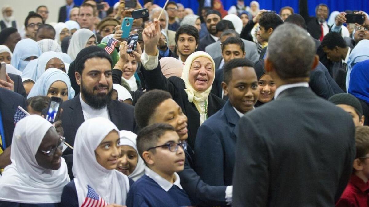 President Barack Obama greets children and other guests during his visit to the Islamic Society of Baltimore on Wednesday.
