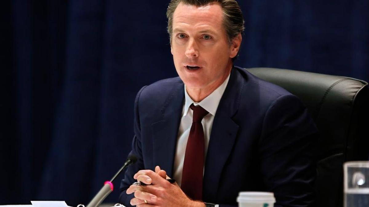 California Lt. Gov. Gavin Newsom discusses a proposal to expand financial aid to student athletes in the event of a career-ending sports injury, during a meeting of the University of California governing board on Wednesday.