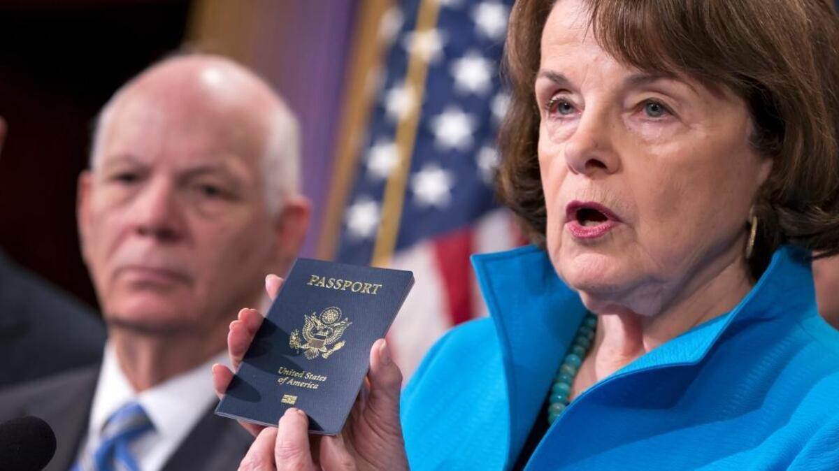 Sen. Dianne Feinstein points to the embedded chip in her passport as she talks last month about a bill to stiffen requirements on visitors to the U.S.
