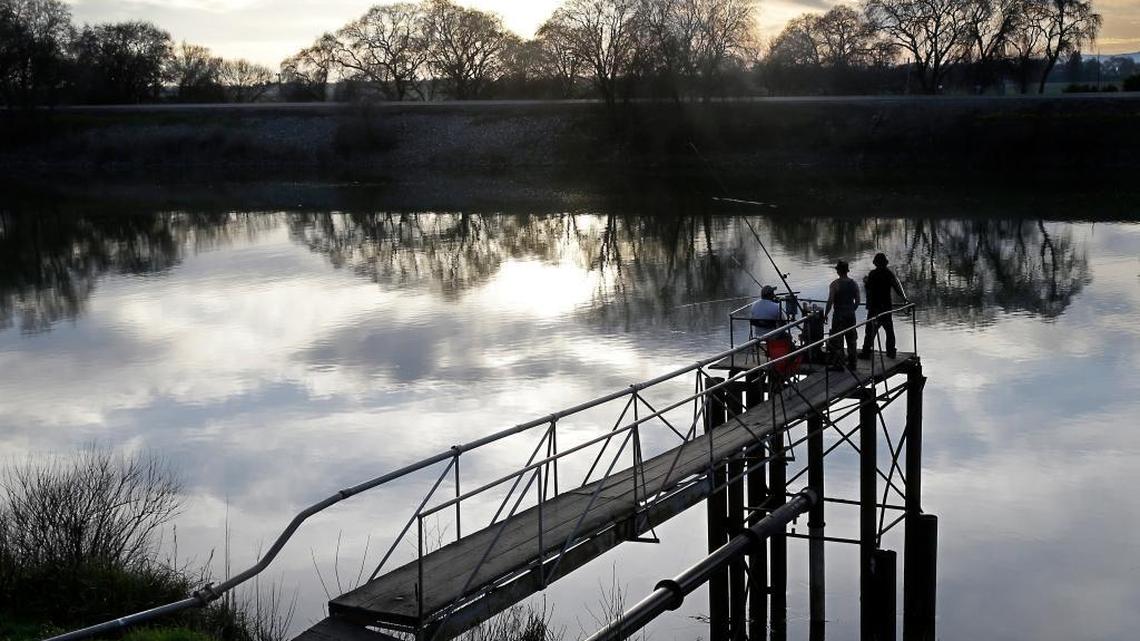 People fish along the Sacramento River in the San Joaquin-Sacramento River Delta, near Courtland.