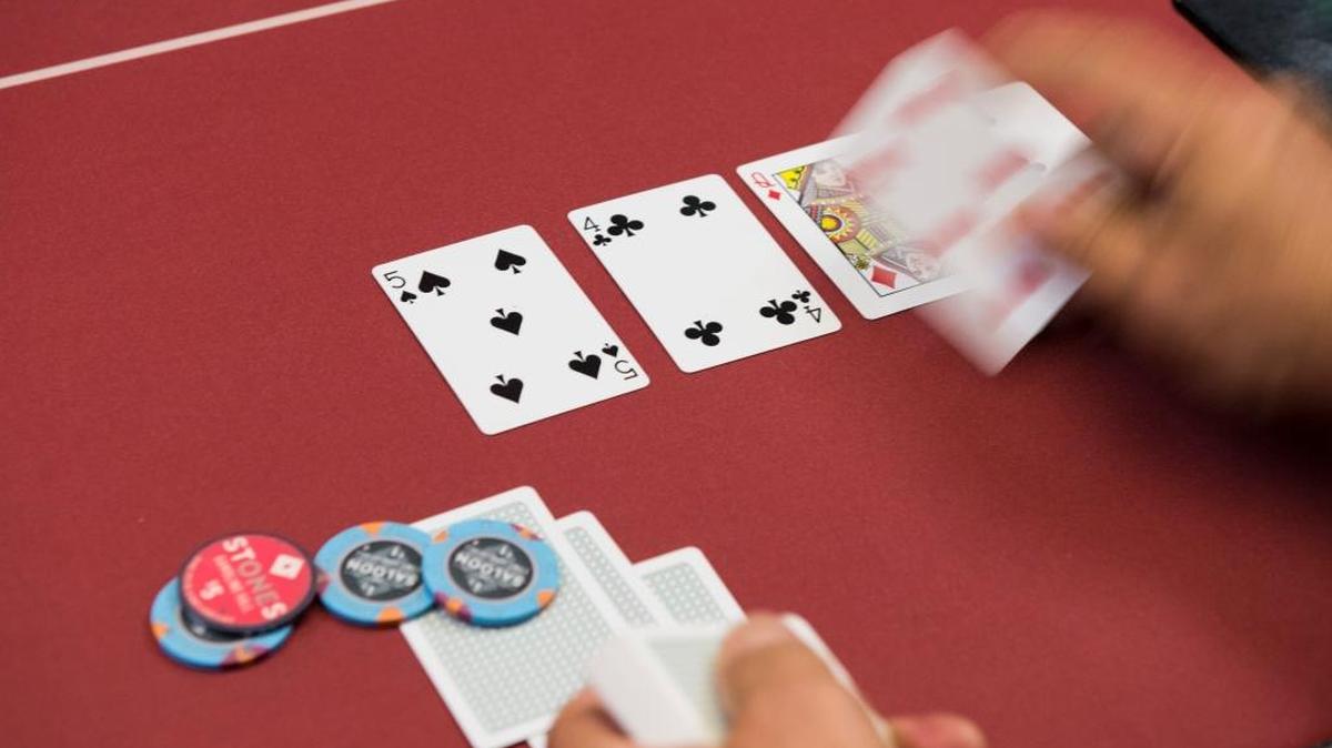 A game of Texas Hold ’em is dealt at the Stones Gambling Hall in Citrus Heights. A bill by Assemblyman Adam Gray would legalize poker on the internet in California.