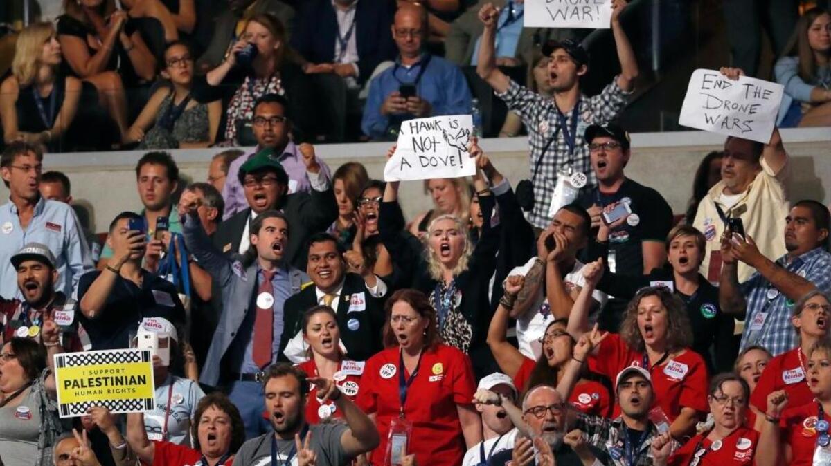 Activists heckle former Leon Panetta, the former defense secretary and CIA director, as he speaks Wednesday during the Democratic National Convention in Philadelphia.