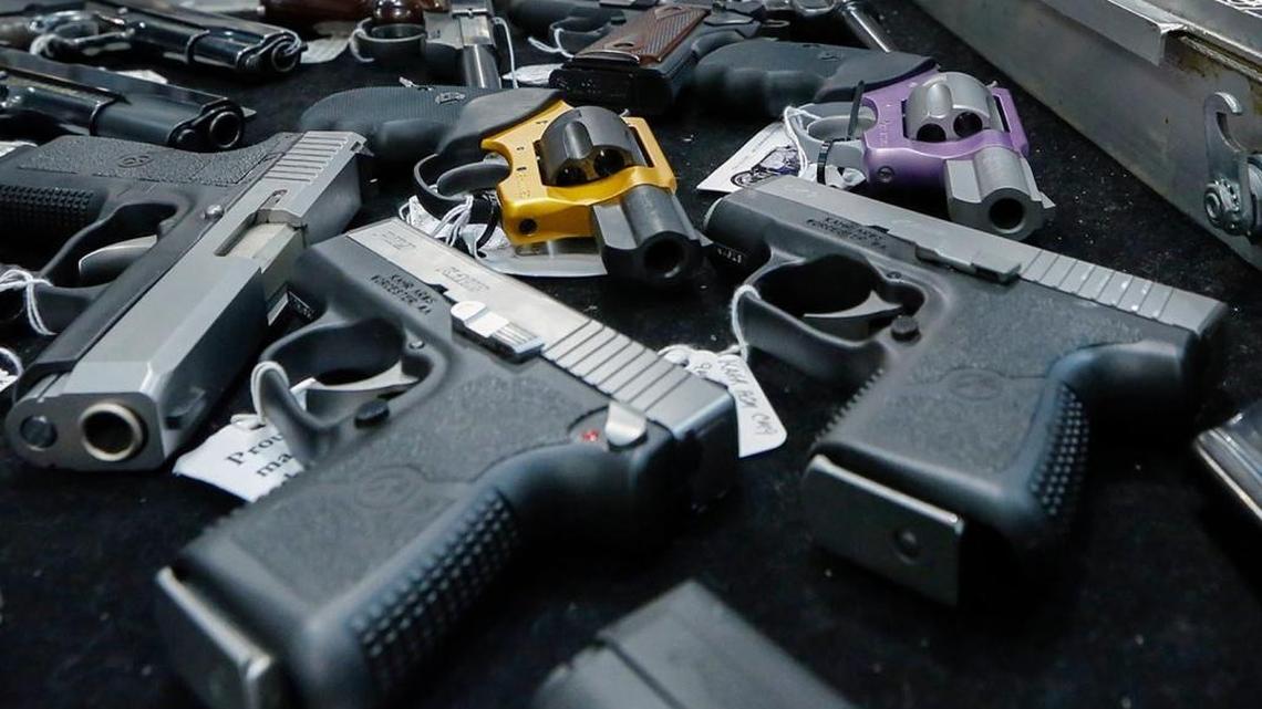 Handguns are displayed on a vendor’s table at an annual New York gun show. Nearly 250 children were shot accidentally in 2016, nationally.