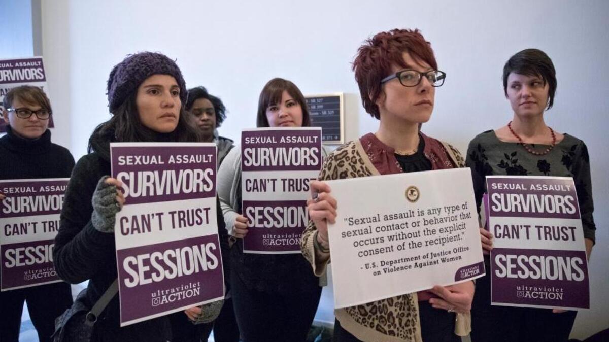 A women’s advocacy group that included some sexual assault survivors protests Monday outside the office of Sen. Jeff Sessions, President-elect Donald Trump’s nominee to be attorney general.