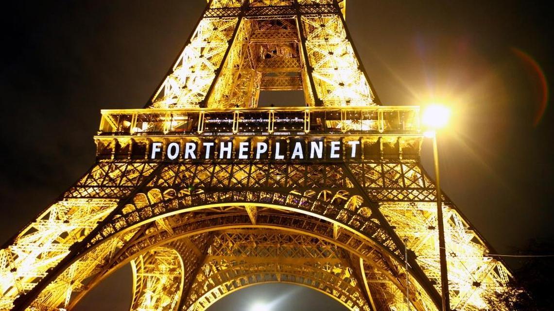 The slogan “For the Planet” is projected on the Eiffel Tower as part of COP21, the United Nations Climate Change Conference in Paris.