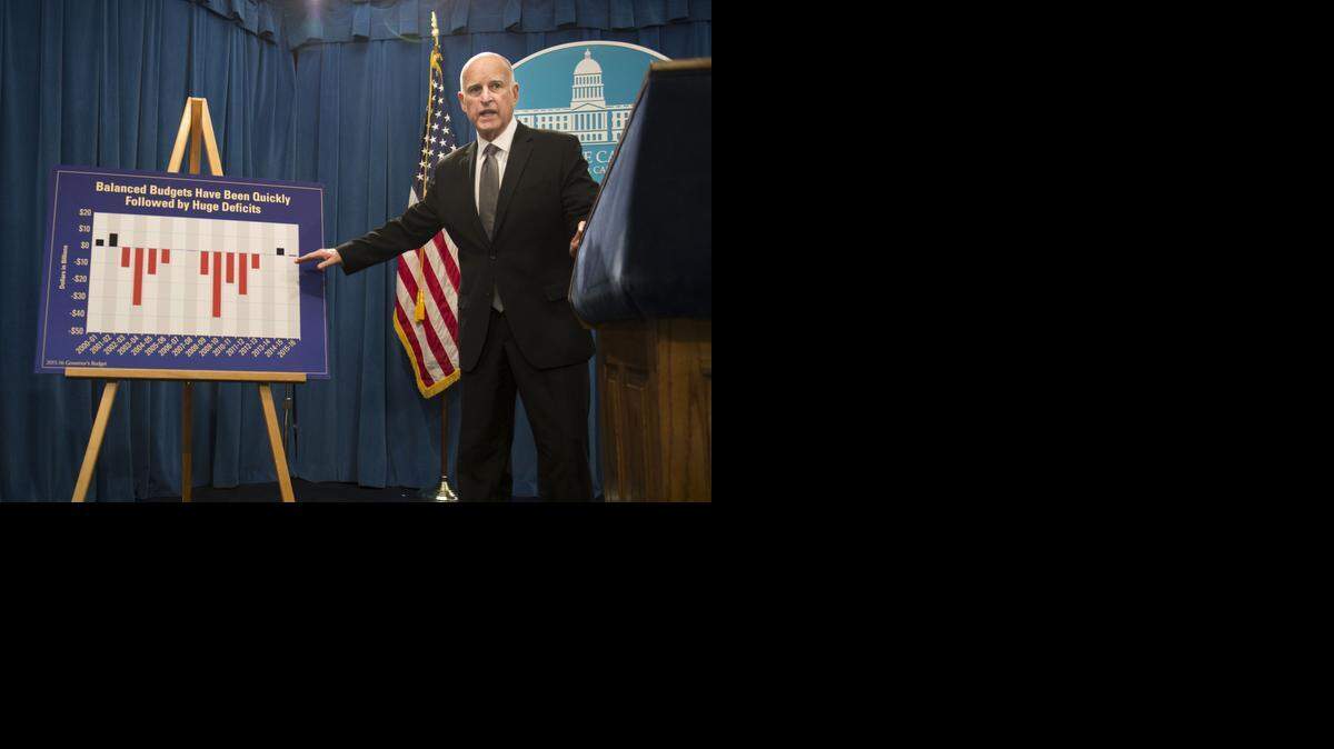 
Gov. Jerry Brown unveils the 2015-16 state budget at the Capitol in Sacramento on Friday.
