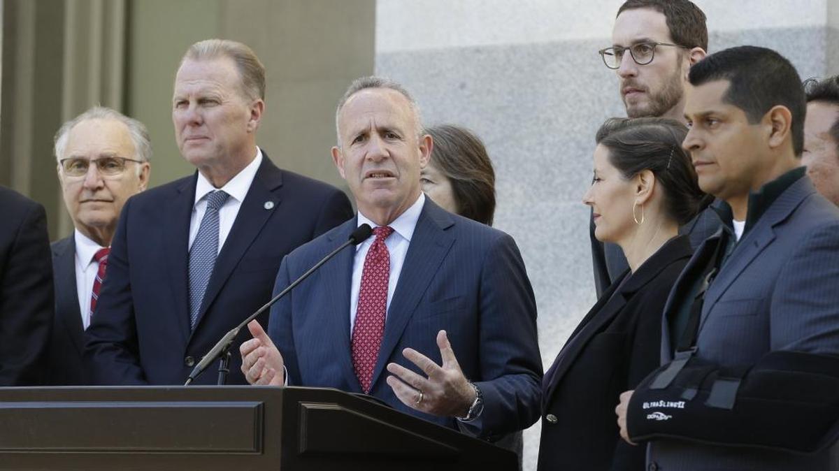 Sacramento Mayor Darrell Steinberg, center, discusses California’s growing homeless crisis at the state Capitol on Wednesday.