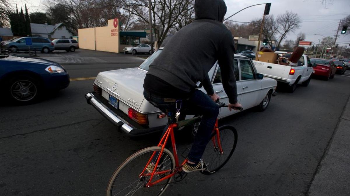
Bicyclists have little room navigating along Freeport Boulevard, a four-lane commuter route in Sacramento.
