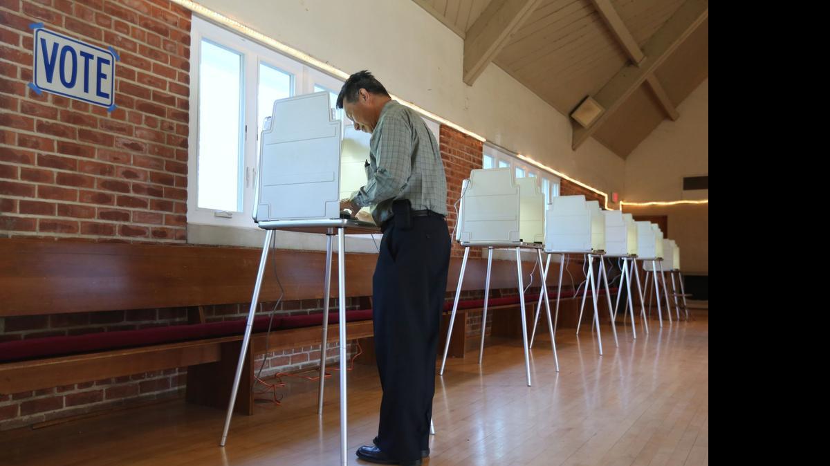 
Mike Lee marks his ballot in California’s June 2014 primary, which had a record low voter turnout. Secretary of State Alex Padilla is proposing a plan to expand voting by mail. 
