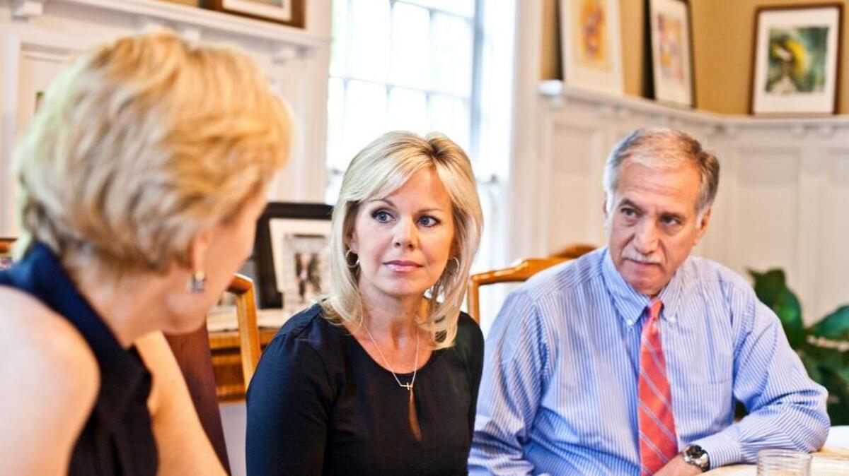 Gretchen Carlson, center, with attorneys Martin Hyman and Nancy Erika Smith, won a reported $20 million settlement and apology from Fox News.