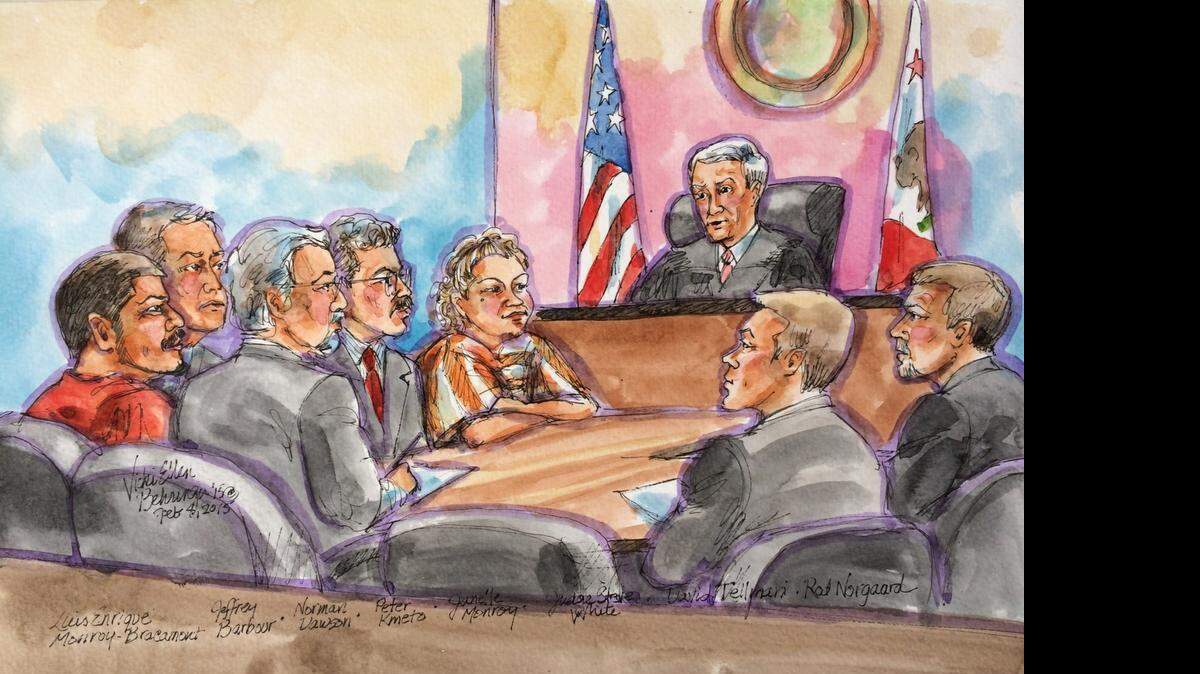 
A courtroom sketch from a hearing in the case of Luis Enriquez Monroy Bracamontes, left, and his wife, Janelle Monroy, center. The two are accused of killing two deputies in October, but cameras have been banned from the courtroom. 
