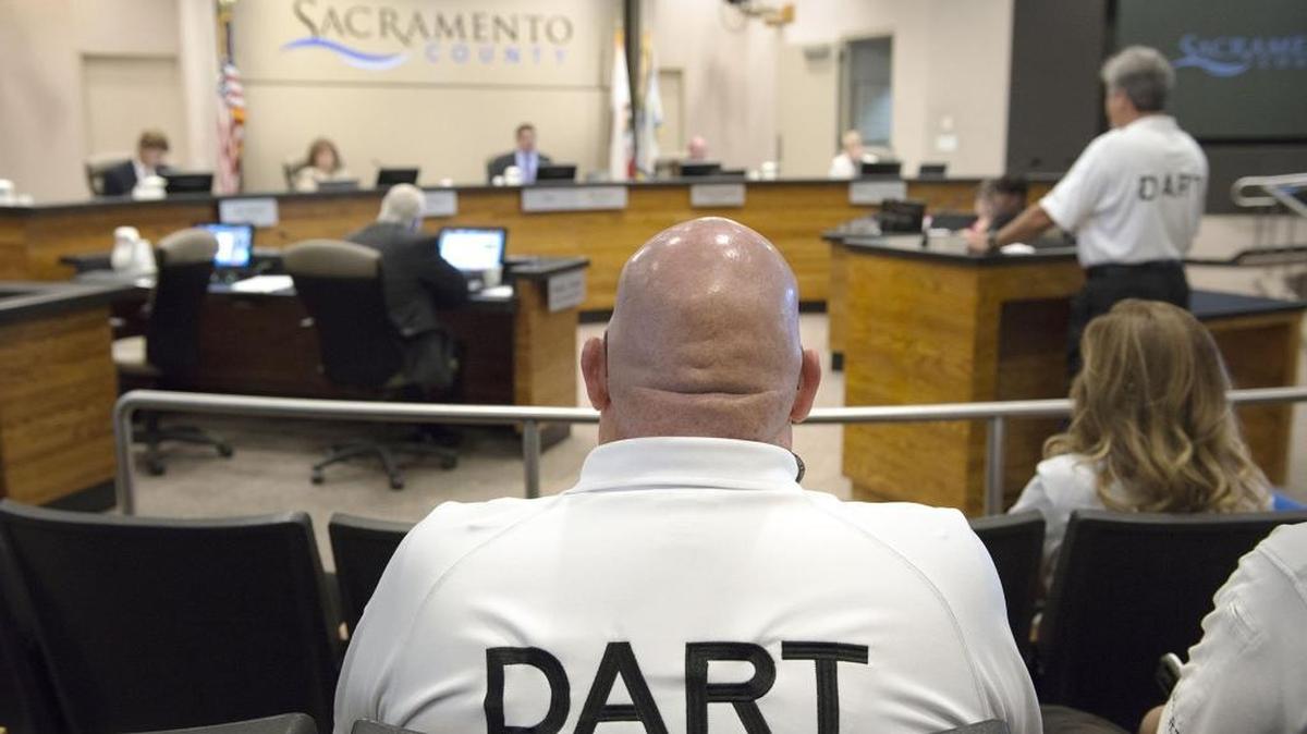 Jim Collentine, chief of operations for the region’s all-volunteer Drowning Rescue Accident Rescue Team, listens at a Sacramento County Board of Supervisors meeting last summer. Supervisor candidates in the coming election face the need to fix a host of local issues, including homelessness, public transit and housing growth.