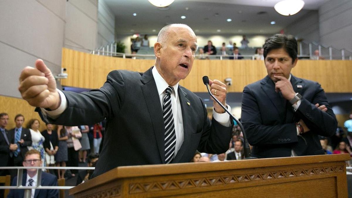 California Gov. Jerry Brown, left, joined by Senate President Pro Tem Kevin de Leon urges the Senate Environmental Quality Committee to approve a pair of climate change bills last week.
