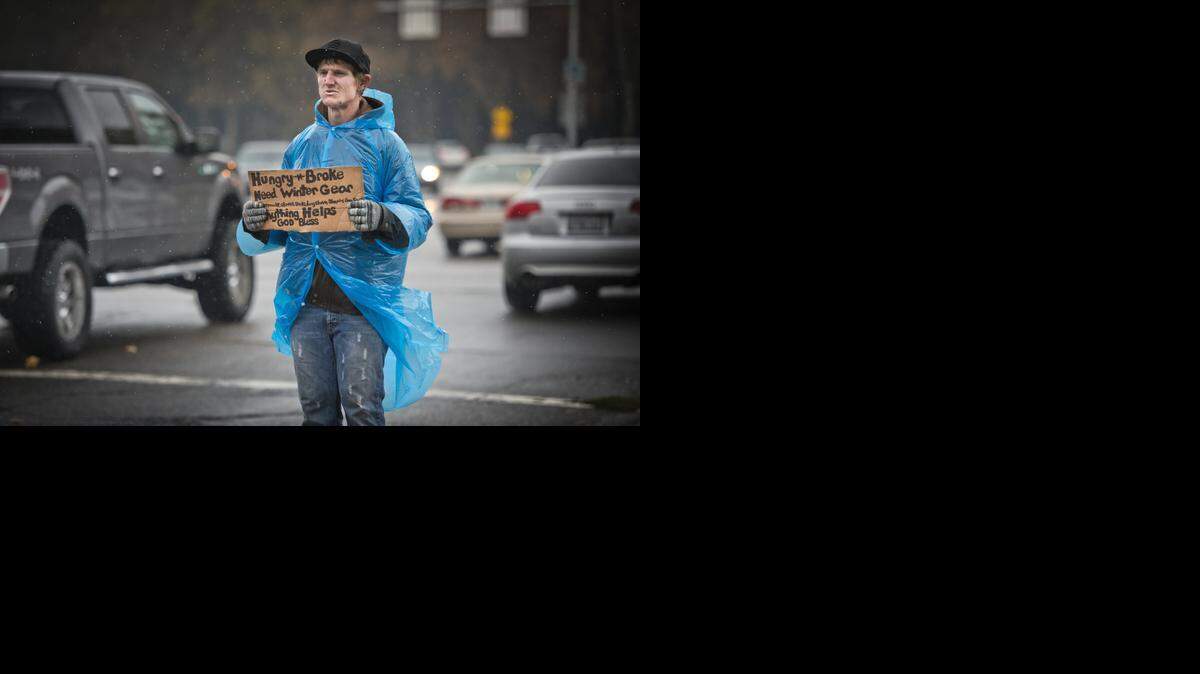 
Dustin Rae, 27, of Sacramento, panhandles on the corner of Howe Ave. and Fair Oaks Blvd. on Wednesday. Rae said he lived in a house up to a year ago with his girlfriend, and now they take refuge in the area. “It sucks that you have to get up early and everyone judges you as the guy that stinks, but there is also some people that are kind and bless you,” said Rae about having to leave early in the morning from the local businesses where he and his girlfriend spend the night.
